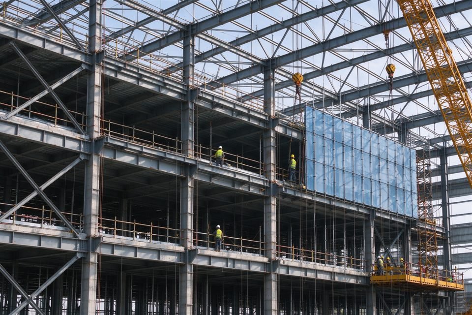 Steel structure and facade work on a building construction site