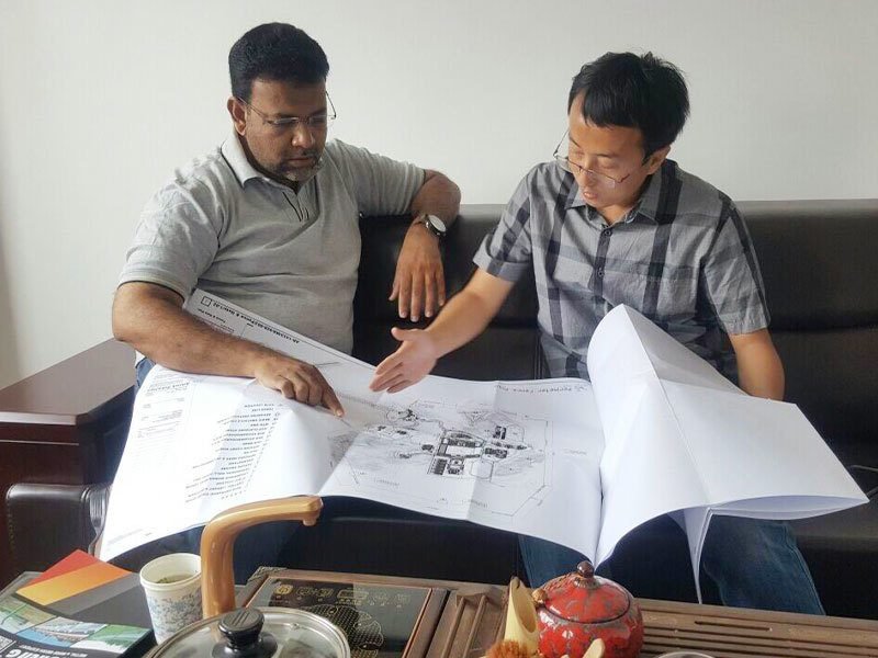 Horizon Metal team reviewing project drawings with an international customer